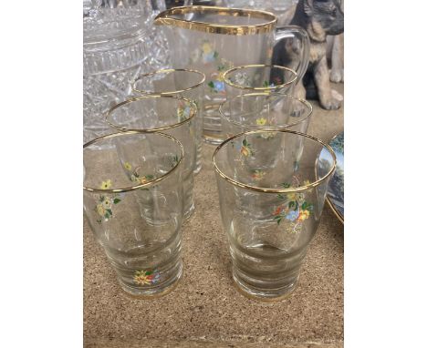 A VINTAGE GLASS LEMONADE SET FLORAL WITH GOLD RIM 