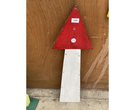 A WOODEN HAND PAINTED ARROW SIGN 