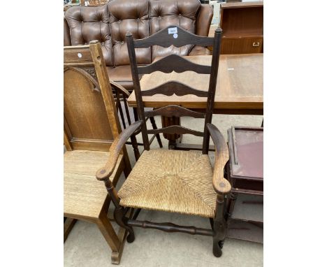 AN OAK + ELM LANCASHIRE LADDER BACK ELBOW CHAIR WITH RUSH SEAT 