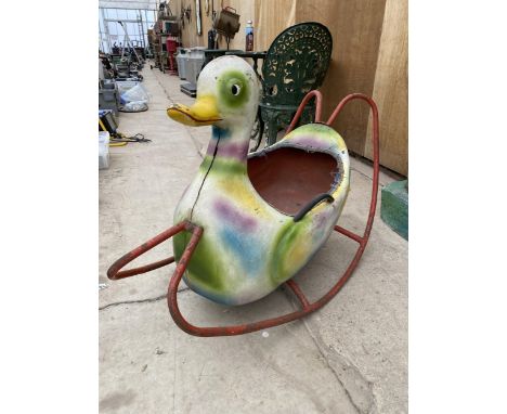 A VINTAGE PLASTIC CHILDS ROCKING DUCK WITH METAL FRAME 