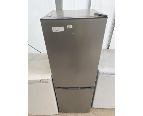 A SILVER LOGIK UPRIGHT FRIDGE FREEZER VENDOR STATES ONLY 3 WEEKS OLD BELIEVED IN WORKING ORDER BUT NO WARRANTY 
