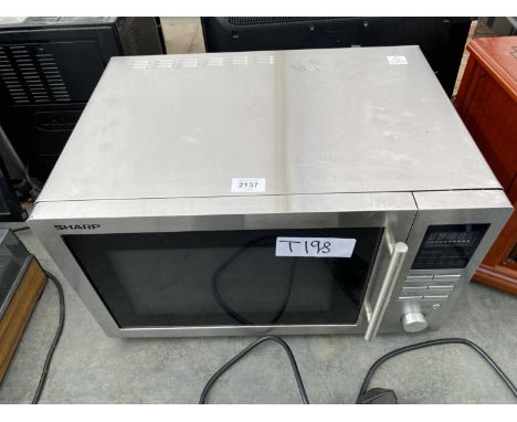A SILVER SHARP MICROWAVE OVEN 