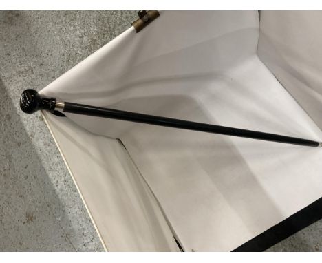 A WALKING STICK WITH VW LOGO 