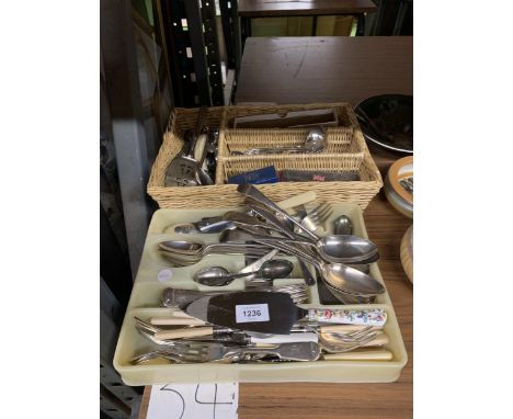 A LARGE QUANTITY OF FLATWARE TO INCLUDE KNIVES, FORKS, SOUP LADLE, CAKE SLICE, ETC 