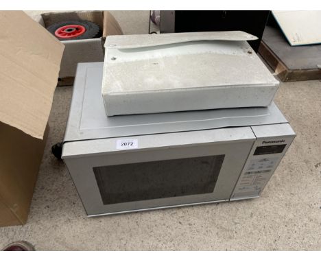 A SILVER PANASONIC MICROWAVE OVEN 