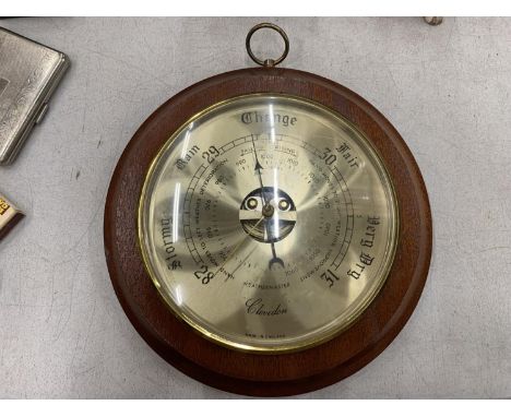 A WEATHERMASTER, CLEVEDON ROUND BRASS BAROMETER WITH WOODEN FRAME 