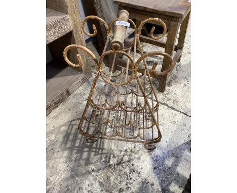 A VINTAGE METAL WINE BOTTLE RACK 