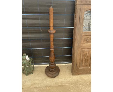 AN INDIAN HARDWOOD STANDARD LAMP 