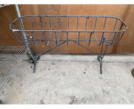 A WROUGHT IRON HAYRACK TROUGH PLANTER ON LEGS (L:91CM) 
