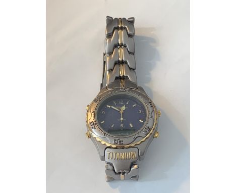 A TITANIUM WRISTWATCH SEEN WORKING BUT NO WARRANTY 