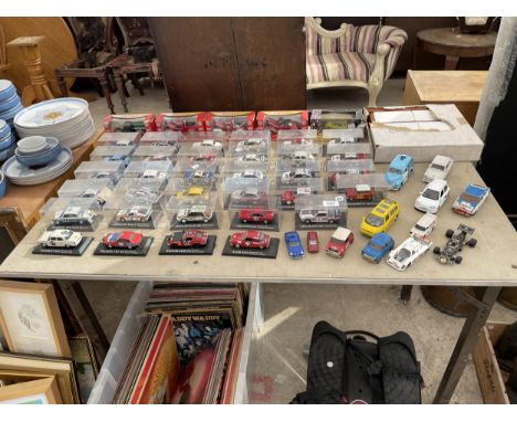 A LARGE ASSORTMENT OF BOXED MODEL CARS AND VEHICLES 