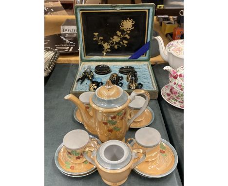 AN ORANGE LUSTRE COFFEE SET TO INCLUDE A COFFEE POT, SUGAR BASIN CUPS AND SAUCERS PLUS A SET OF ORIENTAL STYLE CUPS, SAUCERS,