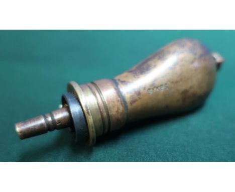 Small brass and copper muff pistol powder flask with plain bag shaped body marked Sykes, with lanyard ring (length 8cm) 