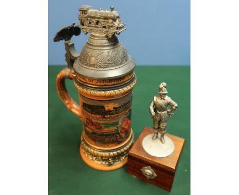 Pewter statuette and a German beer stein, the pewter lid with eagle and railway engine (2) 