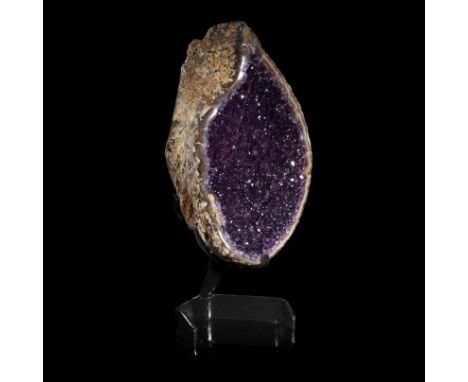 Minerals: An amethyst geode, Uruguay, on stand, 47cm high overall