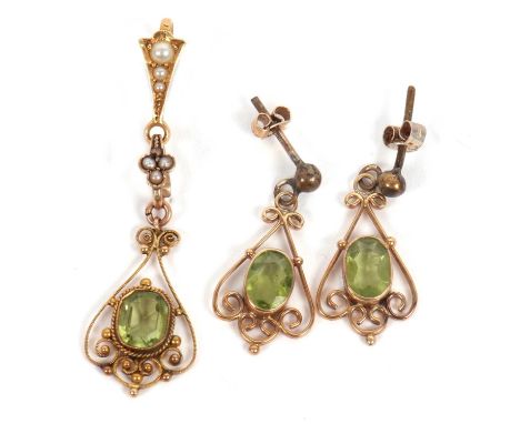 A peridot pendant and similar earrings, the pendant set with a cushion cut peridot in a cannetille style setting of unmarked 