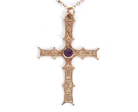A 9ct amethyst cross and chain, the cross pendant set to centre with a round amethyst, Celtic design throughout front and bac