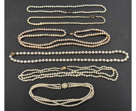 A quantity of cultured pearls with gold clasps: to include a three strand choker with cluster clasp in 9ct mount stamped 375 