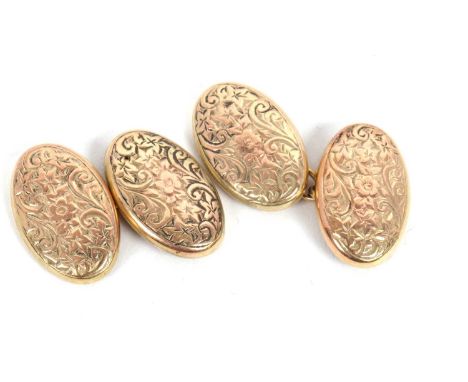A pair of 9ct cufflinks, the oval cufflinks with engraved decoration, stamped 9.375 and hallmarked Birmingham 1908, 4.3g