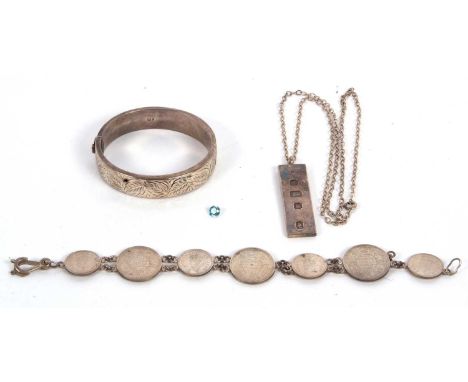 A mixed lot of silver and jewellery: to include a silver hinged bangle; a silver ingot pendant and chain stamped Sterling; a 