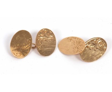 A pair of 9ct cufflinks, the oval discs with engraved decoration, hallmarked Chester 1938, 4.2g