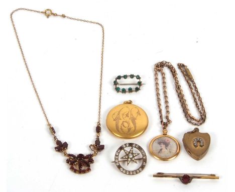 A mixed lot of jewellery: to include a garnet style necklace; an unmarked yellow metal locket dated 1910; three paste brooche