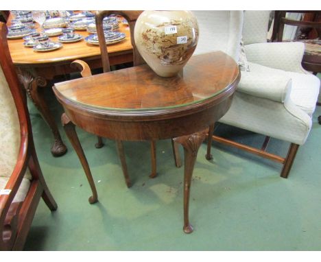 A George V walnut folding card table with slender cabriole legs to pad feet, a/f, 77cm high x 84cm wide