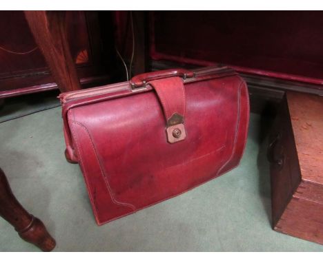 A tan leather vintage doctors attaché case, with side zipped pocket 