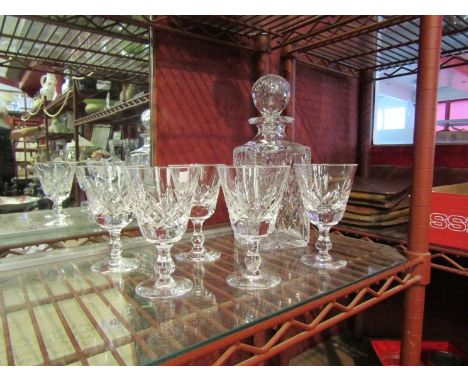 A glass decanter together with five Stuart crystal wine glasses