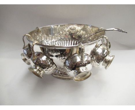 A silver plated punch bowl marked "copper on silver" to base, with six cups plus ladle, together with glass based tankard and