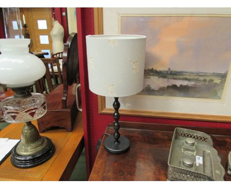 A bobbin turned style table lamp with stag design shade 