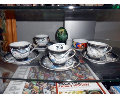 A vintage 8 piece Japanese teaset with image to base of cup, 1 cup has small chip, A Japanese cup and saucer, 2 Japanese/Chin