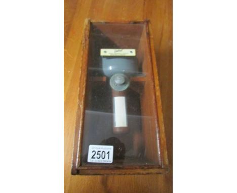 A cased hand held compass.
