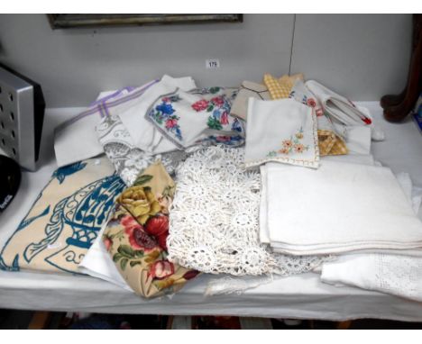 A box of household textiles including embroidered linens, a crochet curtain/throw and partially embroidered vintage textile p