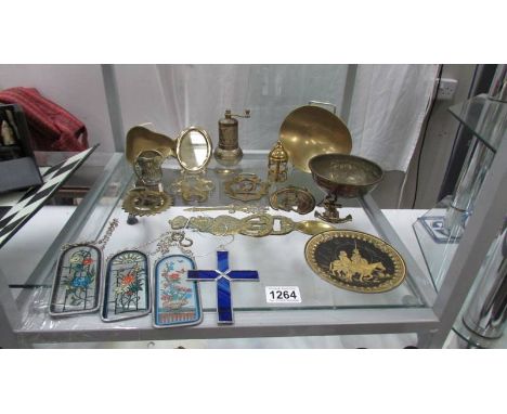 A mixed lot including horse brasses, light catchers etc.,