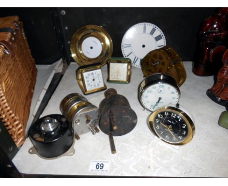 A quantity of clocks, (travel) plus clock parts