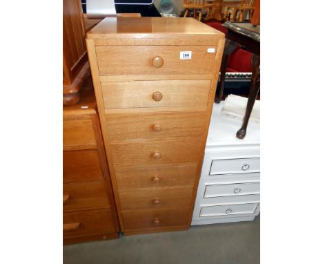 A vintage oak narrow chest with 7 drawers 45.5cm x 49.5cm x height 122cm