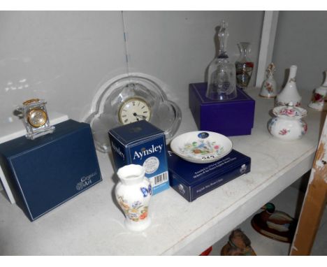 An Edinburgh crystal bell, Aynsley china, glass clock and quantity of other ornaments, some boxed