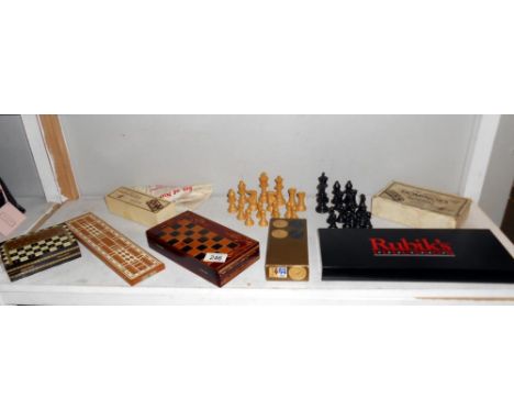 A quantity of vintage chess, draughts, dominoes etc. plus a Rubiks Illusion game, completeness unknown