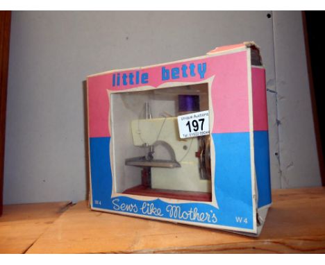 A vintage boxed Little Betty sewing machine