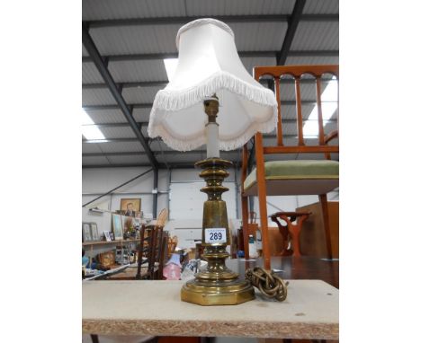 A vintage spelter table lamp with an antique brass finish, Height 54cm to top of shade