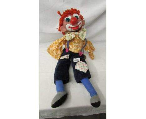 A vintage clown ventriloquist dummy (missing arms), 65 cm tall.