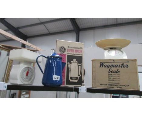 2 sets of kitchen scales, a boxed coffee maker and an enamel coffee pot.