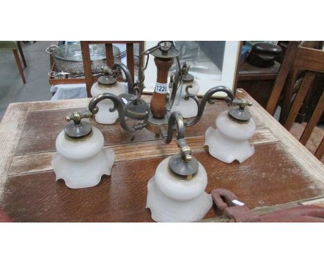 A vintage 5 lamp ceiling light with glass shades.