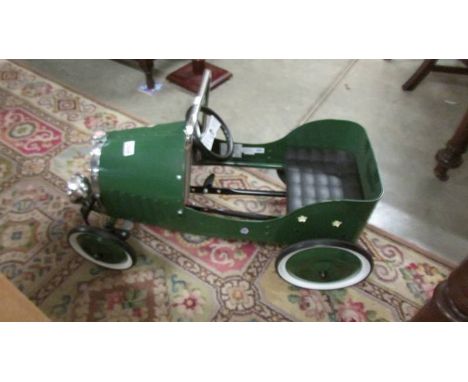A vintage style pedal car. ****Condition report**** In good condition, some stickers in places, working, Length 83cm, width 4