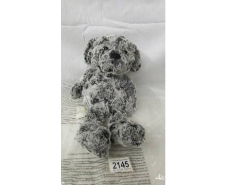 A Steiff 'Soft Cuddly toys' dog.