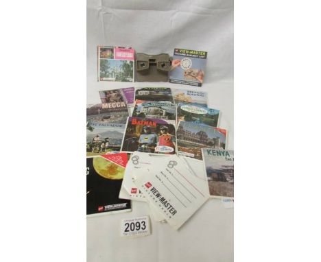 A vintage 3D viewer and several reels. ****Condition report**** Viewer look in good condition, but won't accept photo discs. 
