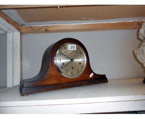 A Napoleon hat mantle clock with pendulum and key ****Condition report**** In working border and in good visual condition.