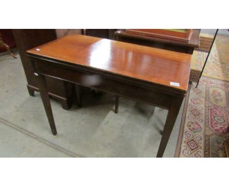 A mahogany fold over games table. ****Condition report**** Frame is robust/sturdy, top turns firmly, felt playing surface is 
