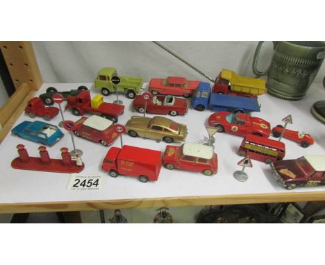 A mixed lot of die cast vehicles, mainly Corgi together with road signs and petrol pumps.